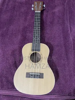 Photo - Brown and beige color ukulele for sale