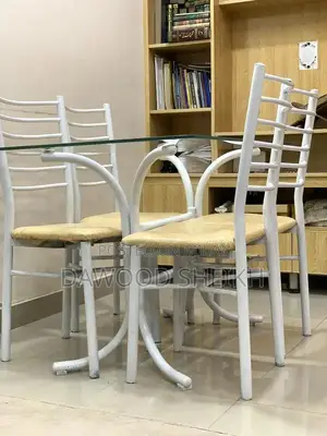 Photo - Wooden Dining Table with Matching Chairs