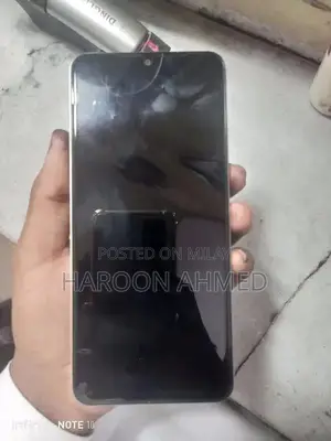 Photo - Compact Smartphone with Full Warranty and Original Accessories