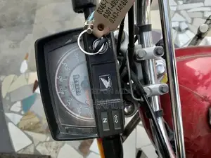Photo - Honda 70cc Lightweight Motorcycle - Reliable City Commuter