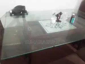 Elegant Glass Dining Table with Six Wooden Chairs