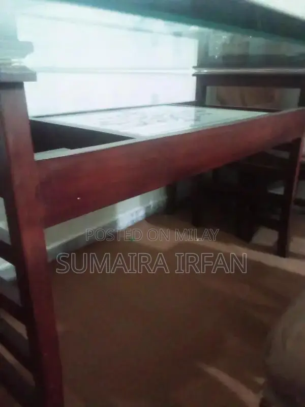 Elegant Glass Dining Table with Six Wooden Chairs