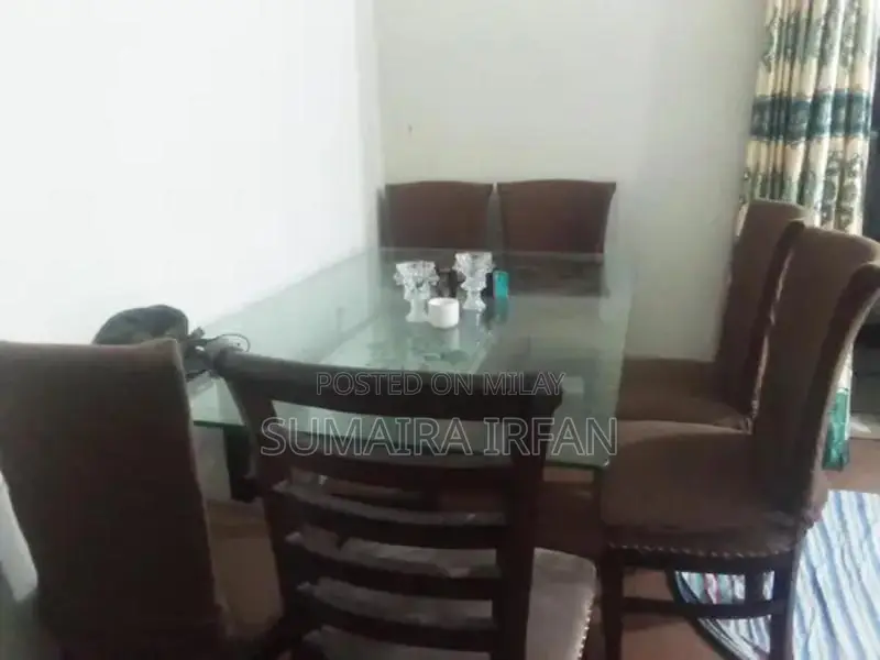 Elegant Glass Dining Table with Six Wooden Chairs