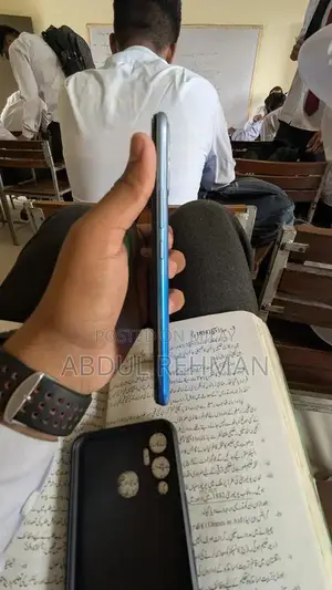 Sleek Compact Electronic Device with Accessories