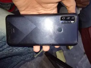 Photo - Compact Smartphone with Minor Wear and Functionality