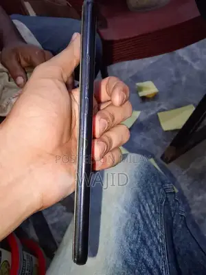 Compact Smartphone with Minor Wear and Functionality