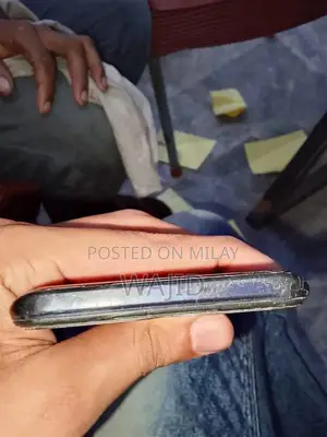 Compact Smartphone with Minor Wear and Functionality