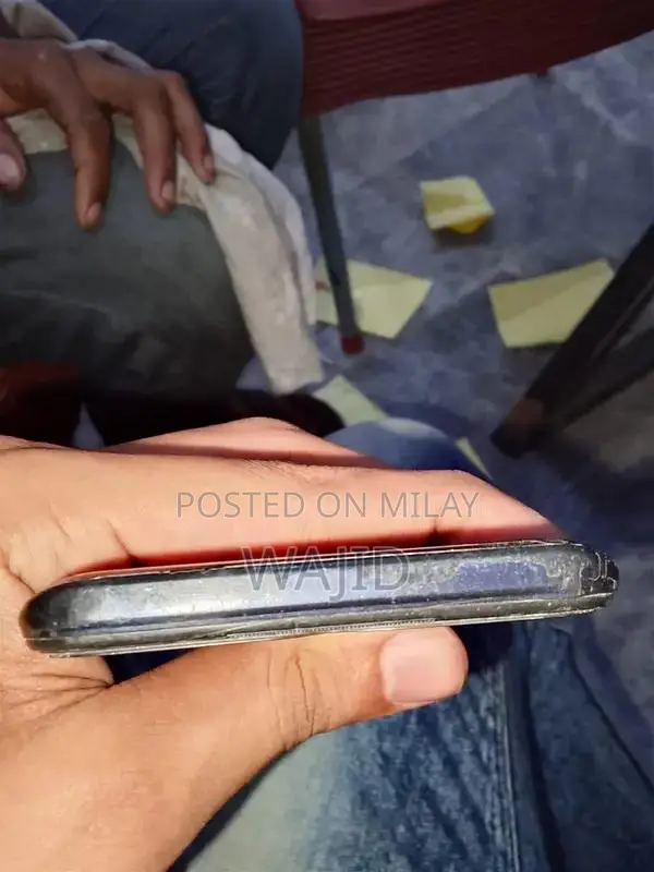 Compact Smartphone with Minor Wear and Functionality