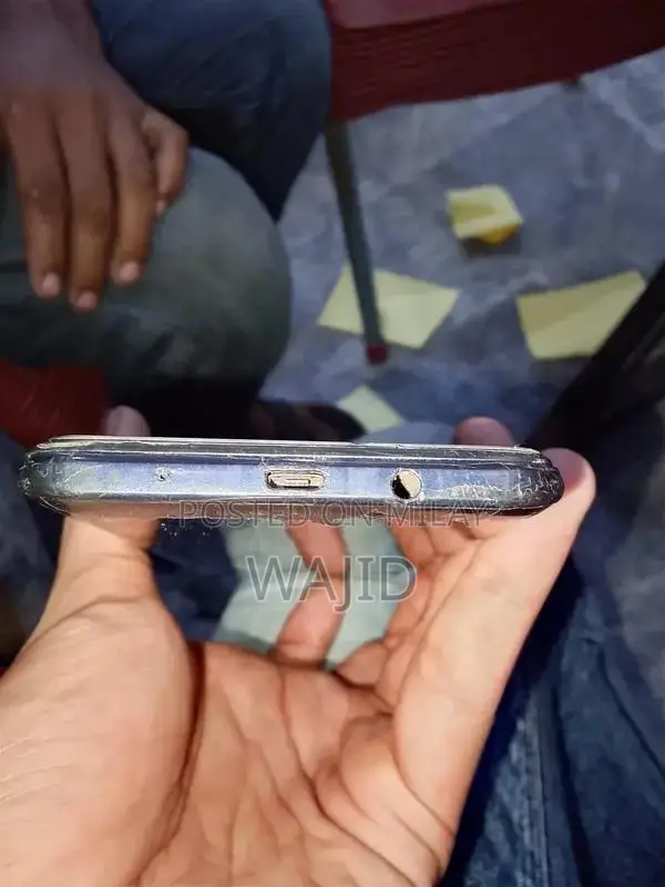 Compact Smartphone with Minor Wear and Functionality