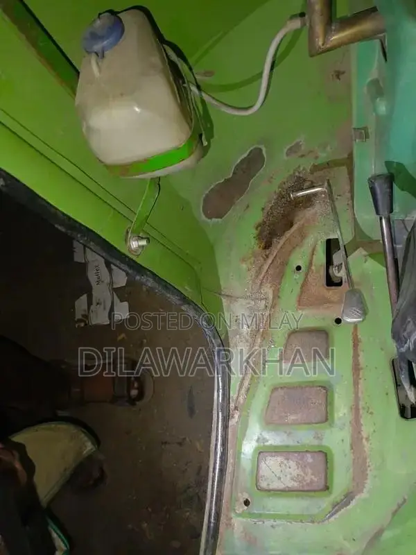 Ricksha Three-Wheeled Vehicle with Unique Engine Configuration