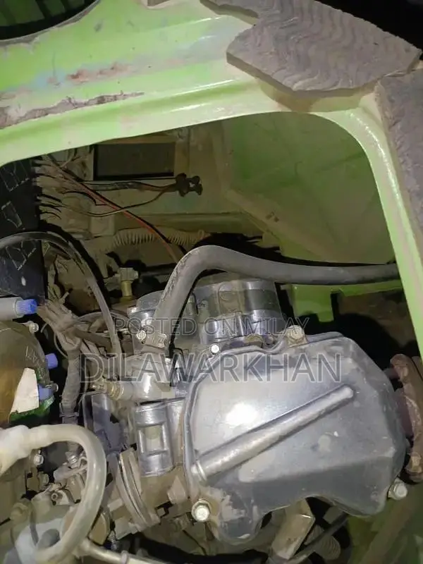 Ricksha Three-Wheeled Vehicle with Unique Engine Configuration