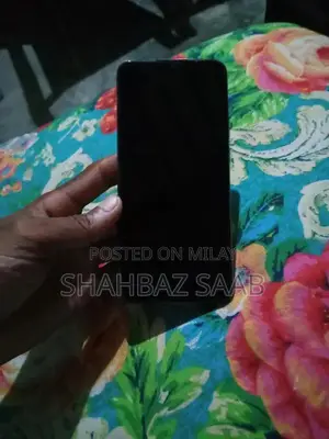 Used Mobile Device with Charger Available for Quick Sale