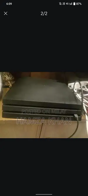 Photo - PlayStation 4 Pro 1TB Gaming Console with Games