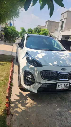 Photo - Kia Sportage AWD White SUV with Low Mileage