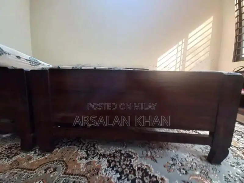 Two Single Wooden Shesham Wood Beds with Foam Mattresses