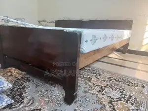 Two Single Wooden Shesham Wood Beds with Foam Mattresses