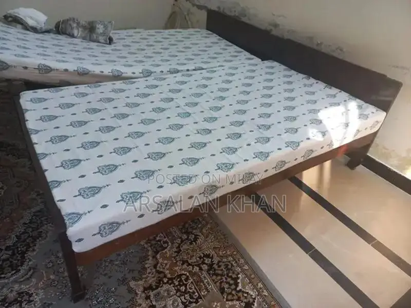 Two Single Wooden Shesham Wood Beds with Foam Mattresses