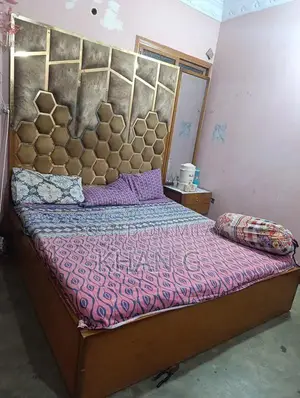 Photo - King Size Bed Frame with 4-Door Dresser