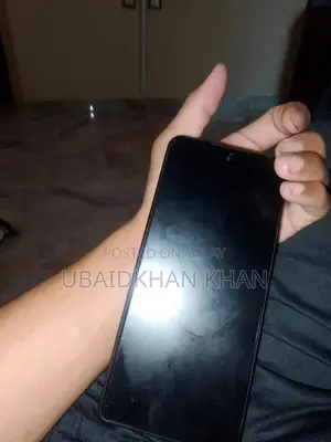 Photo - Smartphone with Charging Box and Partial Accessories