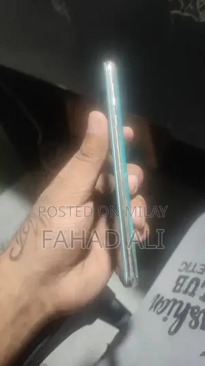 Photo - Compact Smartphone with Dual Camera and Sleek Design