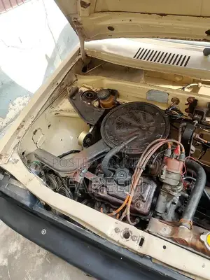 High Mileage 4-Door Car - Imported Vehicle