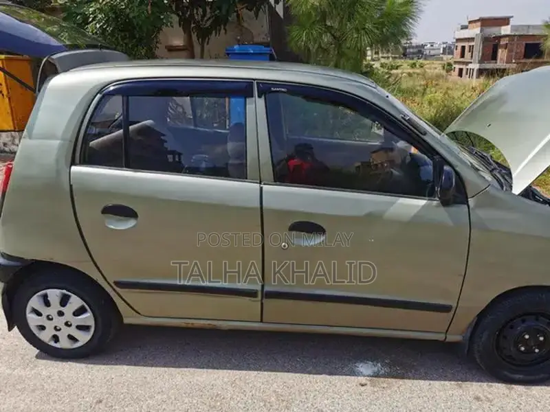 Hyundai Santro Club 2003 Green Compact Sedan with Modern Features