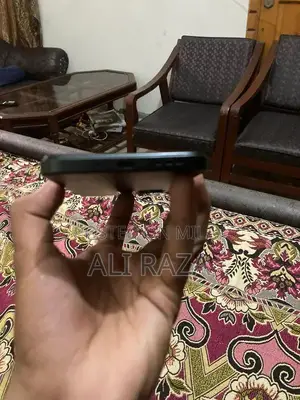 Sleek Smartphone with Original Packaging and Full Functionality