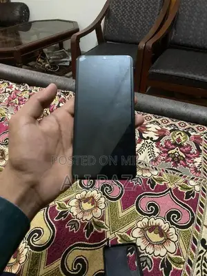 Sleek Smartphone with Original Packaging and Full Functionality
