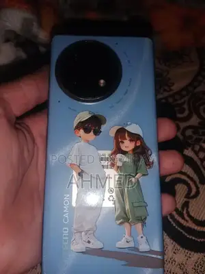 Photo - Compact Mobile Device with Original Packaging and Charger