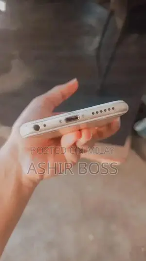 Smartphone with Charging Cable in Good Condition