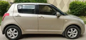 Photo - 2016 Suzuki Swift Automatic Sedan - Golden Color