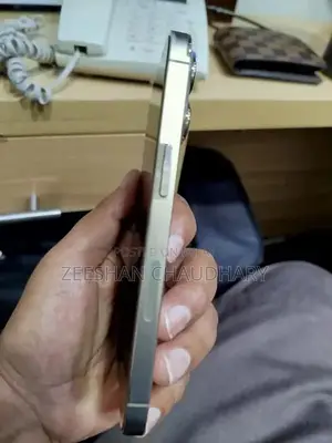 Photo - Premium Golden Apple Smartphone with High Battery Health