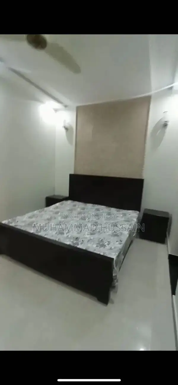 Elegant Brown Wooden Bed Set with Matching Side Tables