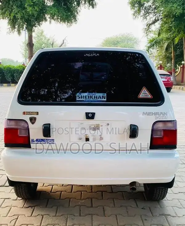Mehran White Sedan with Alloy Rims and LCD Display