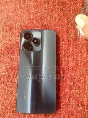 Compact Smartphone with Quad Core Processor and Expandable Storage