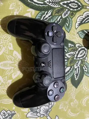 Photo - PlayStation 4 Slim 1TB Gaming Console with Controller and Games