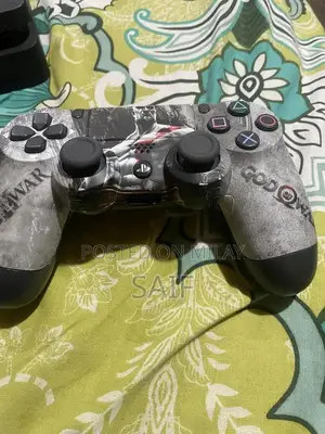 PlayStation 4 Slim 1TB Gaming Console with Controller and Games