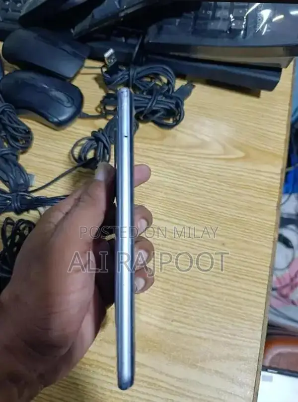 Budget Smartphone with Quad Camera and Slim Design