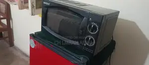 Photo - Used Microwave Oven for Quick Home Cooking