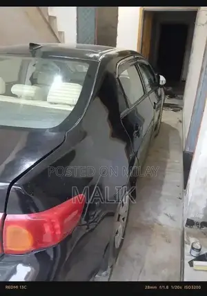 Photo - Suzuki XLI 2010 Model Sedan Sedan with Genuine Parts