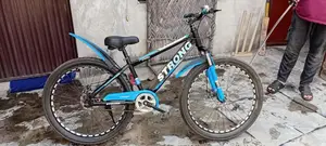 Photo - Blue and Black Fat Tire Bicycle with Front Suspension