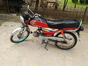 Photo - Honda 70 Motorcycle - 2014 Model Single Cylinder Bike