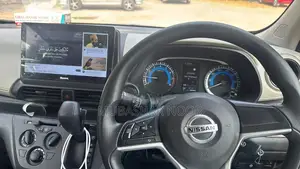 Photo - Nissan Vehicle - Imported Sedan with Multiple Door Options