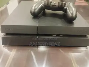 Photo - PlayStation 4 Fat 1TB Gaming Console with Controller