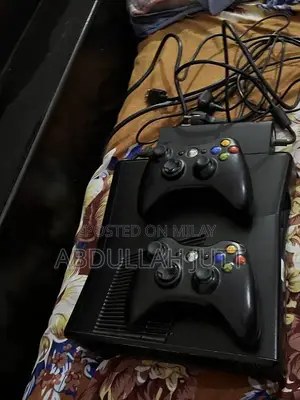 Photo - Xbox 360 Slim 250GB Gaming Console with Wireless Controllers