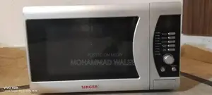 Photo - Singer Silver Black Microwave Oven Kitchen Appliance