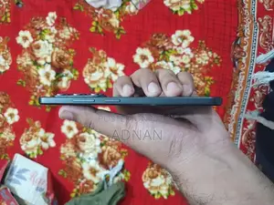 Compact Smartphone with AMOLED Display and Fingerprint Sensor