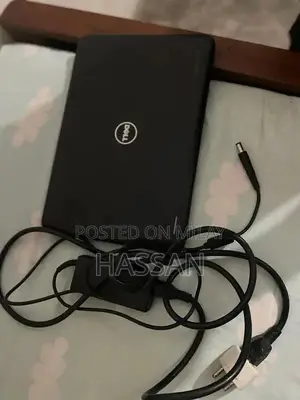 Photo - Laptop with Charging Cable - Portable Computing Solution