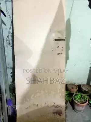 Photo - Steel-Reinforced Wooden Door with Structural Wear