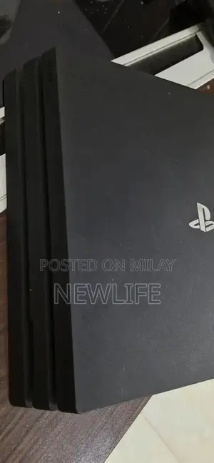 Photo - PlayStation 4 Pro 1TB Gaming Console with GTA 5